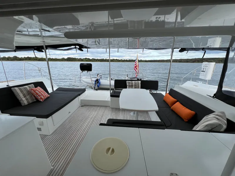 Slide: The Image of Spacious 2019 Lagoon 450 F catamaran interior with comfortable seating and scenic water view. - 39