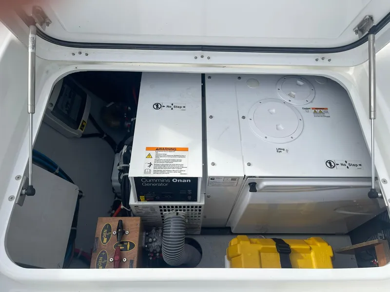 Slide: The Image of Engine compartment of a 2019 Lagoon 450 F catamaran with Cummins Onan generator. - 45