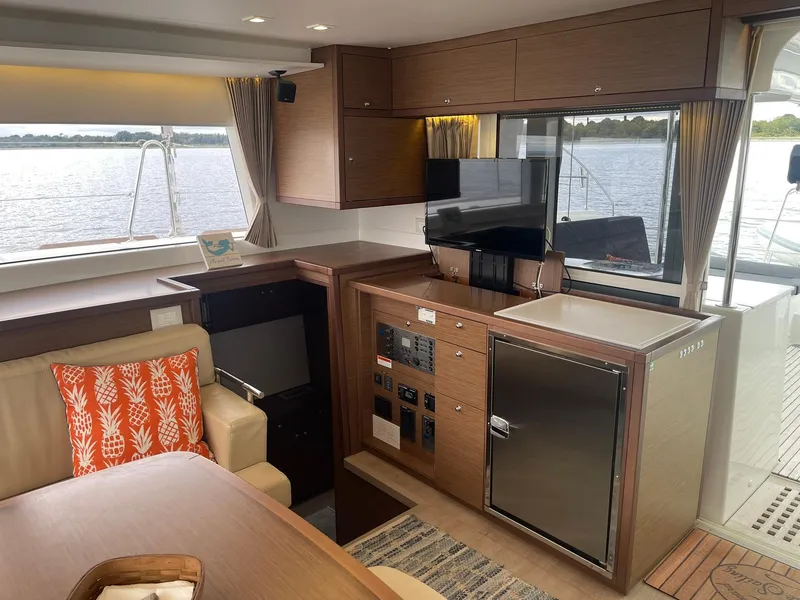 Slide: The Image of Interior of 2019 Lagoon 450 F yacht with modern kitchen and dining area. - 9