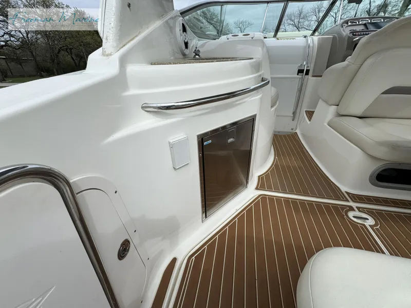 Slide: The Image of 2008 Chaparral Signature 290 interior with sleek seating and wood-patterned flooring. - 10