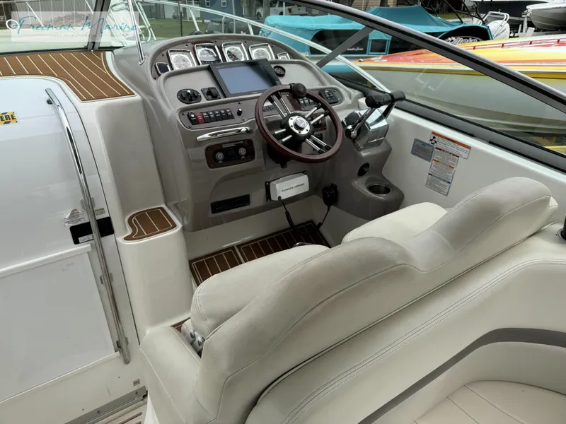 Slide: The Image of 2008 Chaparral Signature 290 boat cockpit with steering wheel and control panel. - 15