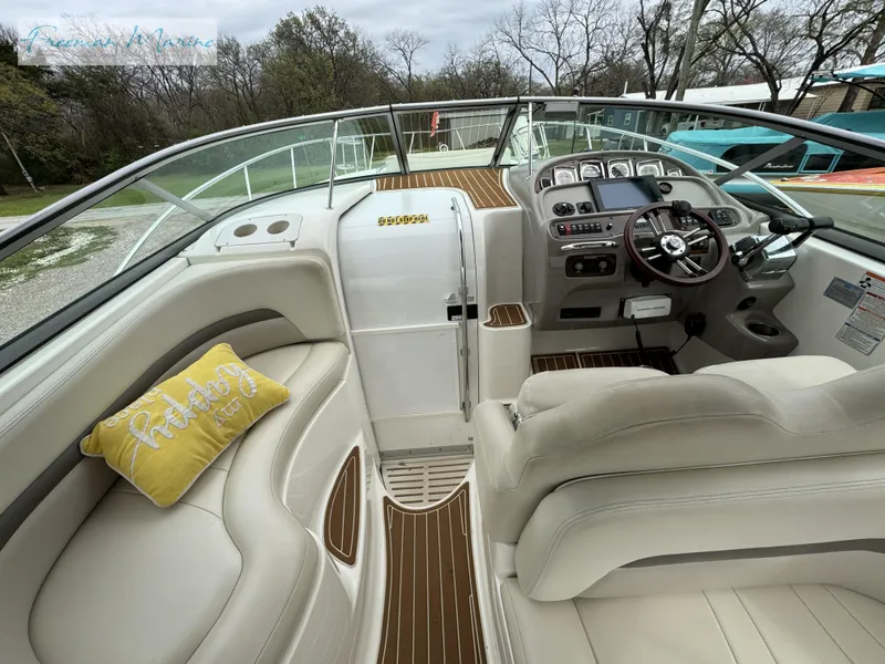 Slide: The Image of 2008 Chaparral Signature 290 boat interior with helm, seating, and yellow pillow. - 16