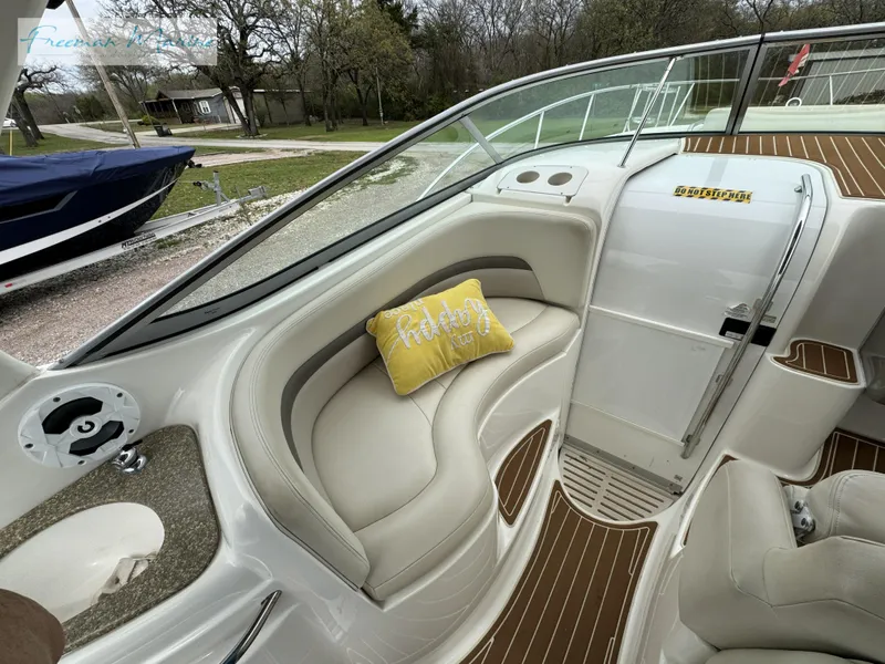 Slide: The Image of 2008 Chaparral Signature 290 boat interior with cushioned seating and decorative pillow. - 17