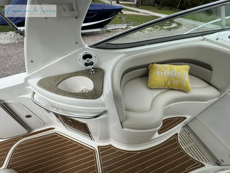 Slide: The Image of 2008 Chaparral Signature 290 interior with cushioned seating and decorative pillow. - 18