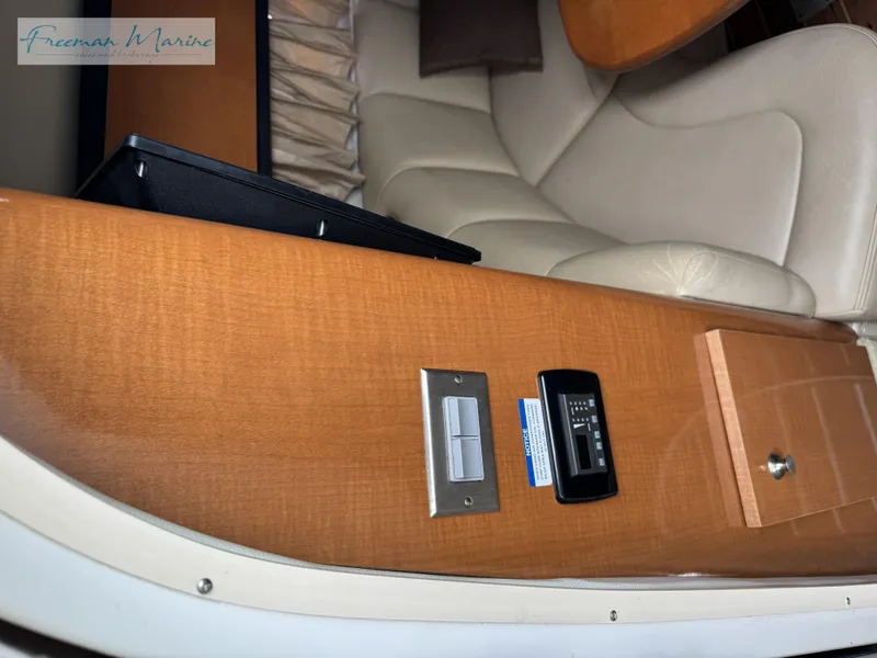 Slide: The Image of 2008 Chaparral Signature 290 interior with wood paneling and seating area. - 21
