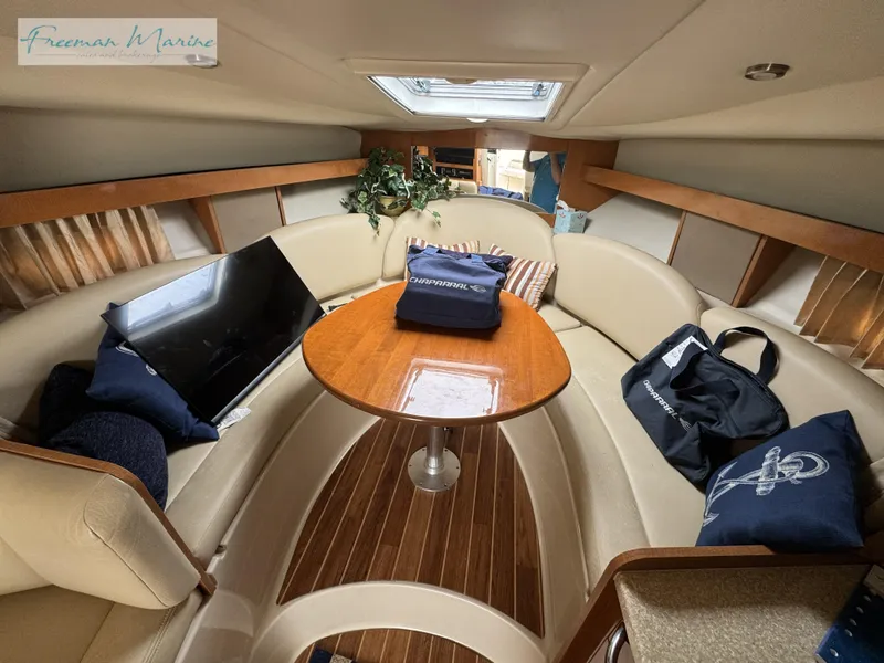 Slide: The Image of 2008 Chaparral Signature 290 cabin interior with seating, table, and decor. - 31