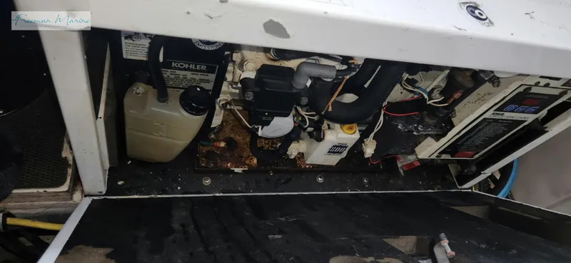 Slide: The Image of Engine compartment of a 2008 Chaparral Signature 290 boat, featuring Kohler components. - 35