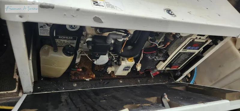 Slide: The Image of Engine compartment of a 2008 Chaparral Signature 290 boat, showing mechanical components and wiring. - 36