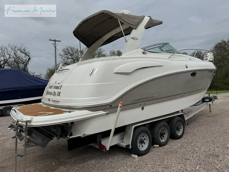 Slide: The Image of 2008 Chaparral Signature 290 boat on a trailer, parked outdoors. - 5