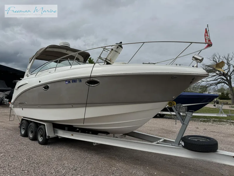 Slide: The Image of 2008 Chaparral Signature 290 boat on trailer, displayed outdoors under cloudy skies. - 6