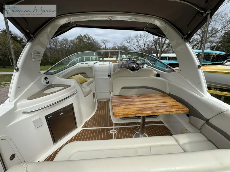 Slide: The Image of 2008 Chaparral Signature 290 boat interior with seating, table, and helm. - 7