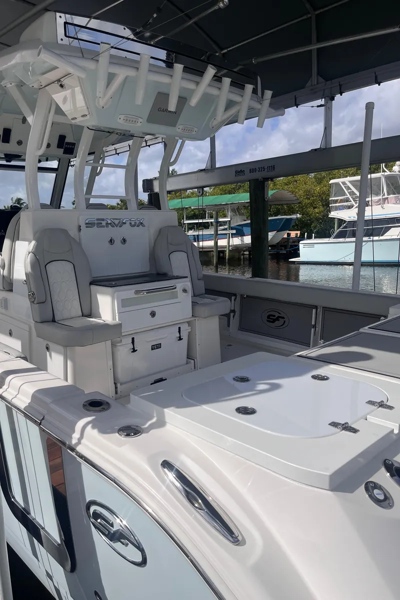 Slide: The Image of 2021 Sea Fox 368 Commander boat with spacious deck and seating area. - 17
