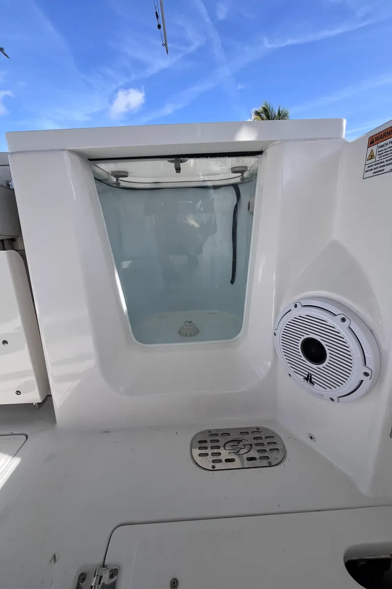 Slide: The Image of 2021 Sea Fox 368 Commander boat interior with speaker and storage compartment. - 18