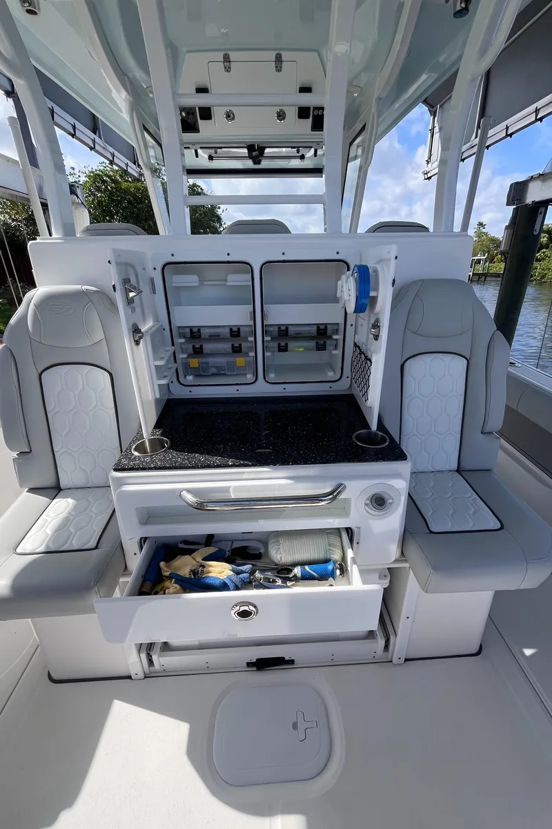 Slide: The Image of 2021 Sea Fox 368 Commander boat interior with seating and storage compartments. - 19