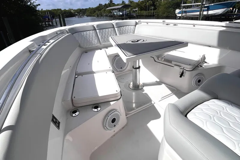 Slide: The Image of 2021 Sea Fox 368 Commander boat interior with seating and table, featuring modern design and amenities. - 24