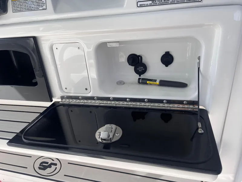 Slide: The Image of 2021 Sea Fox 368 Commander boat console with storage compartment and utility features. - 30