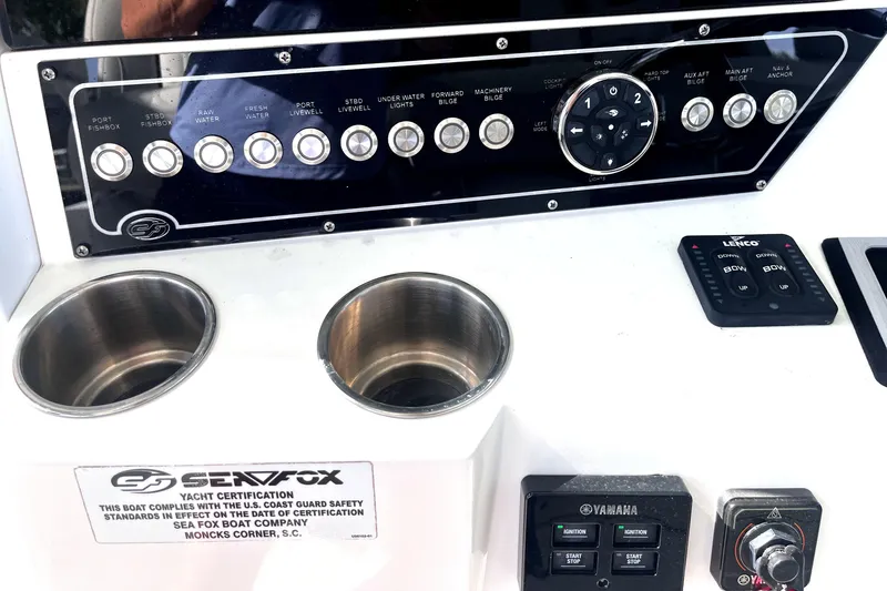 Slide: The Image of Control panel of 2021 Sea Fox 368 Commander boat with cup holders and certification label. - 7