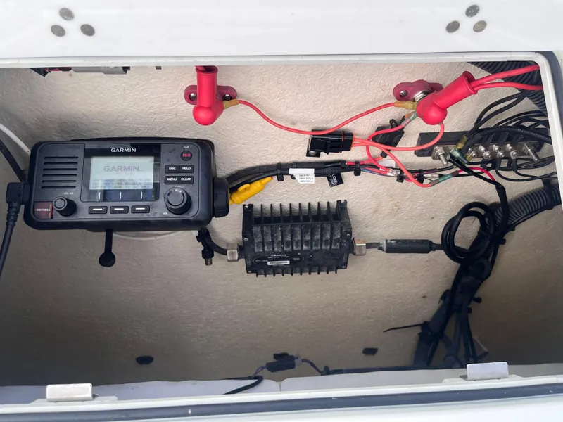 Slide: The Image of Electrical components inside a 2021 Sea Fox 368 Commander boat, featuring a Garmin device. - 9