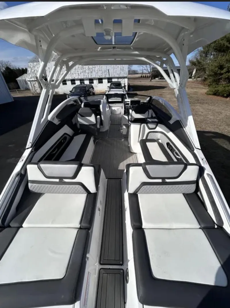 Slide: The Image of 2023 Yamaha Boats 275 SDX interior with spacious seating and modern design. - 2