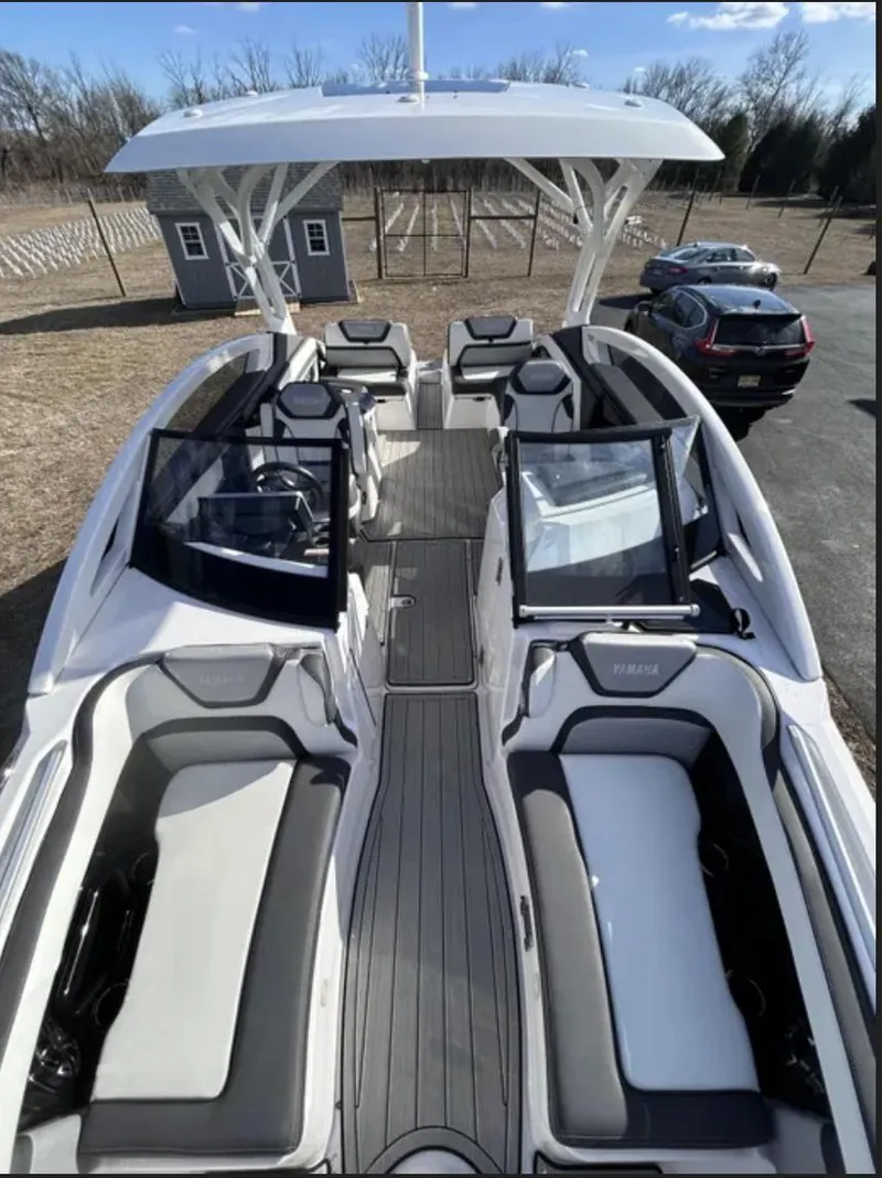Slide: The Image of 2023 Yamaha Boats 275 SDX with spacious seating and sleek design. - 3
