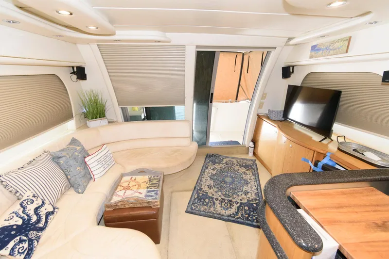 Slide: The Image of Luxurious interior of 2001 Maxum 4100 SCB yacht with cozy seating and modern amenities. - 12