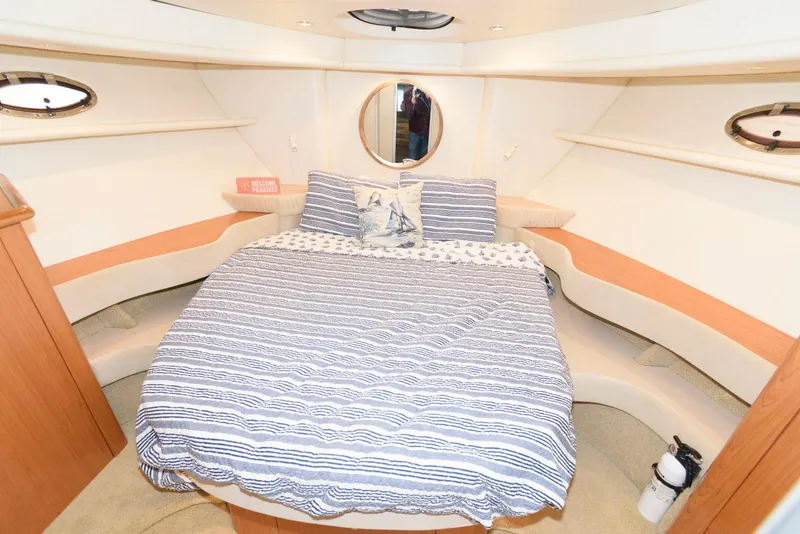 Slide: The Image of Luxurious bedroom interior of 2001 Maxum 4100 SCB yacht with striped bedding. - 18