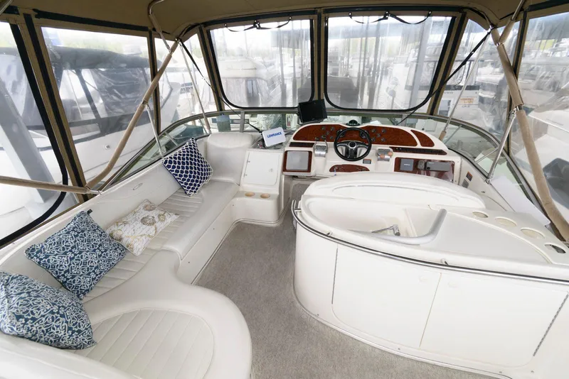 Slide: The Image of Interior of 2001 Maxum 4100 SCB yacht with plush seating and helm. - 5