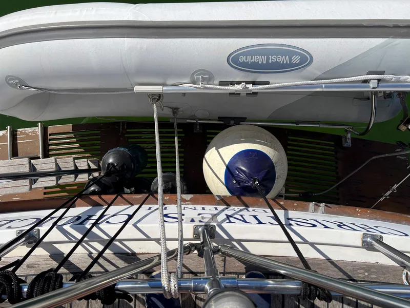 Slide: The Image of Top view of 1983 Lindmark 39 Trawler with dinghy and fender. - 27