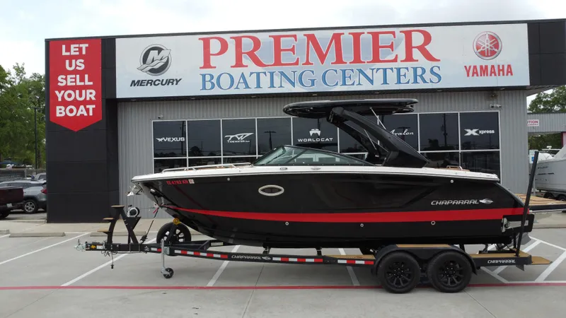 Slide: The Image of 2022 Chaparral 28 Surf boat on trailer at Premier Boating Centers dealership. - 1