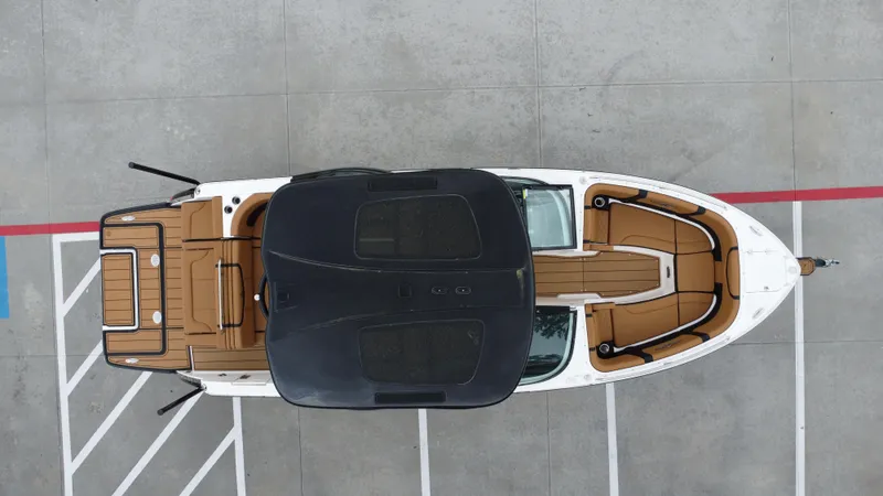 Slide: The Image of Overhead view of 2022 Chaparral 28 Surf boat in parking lot. - 18