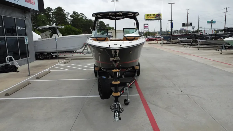 Slide: The Image of 2022 Chaparral 28 Surf boat on trailer at dealership parking lot. - 5