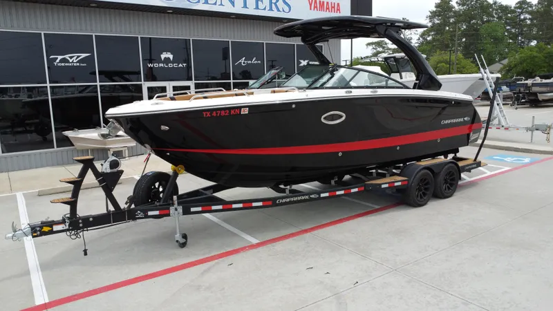 Slide: The Image of 2022 Chaparral 28 Surf boat on trailer at dealership parking lot. - 6