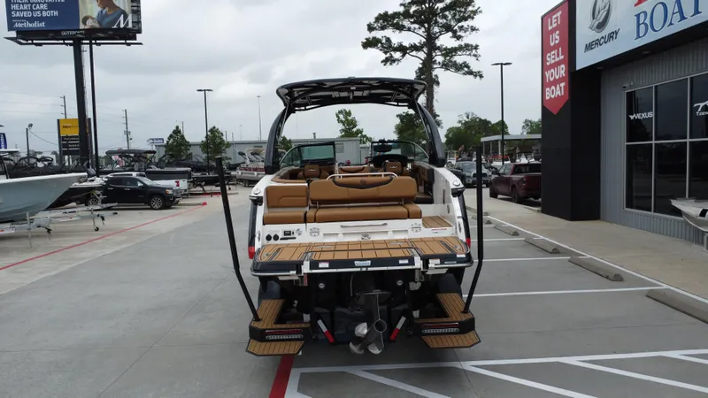 Slide: The Image of 2022 Chaparral 28 Surf boat displayed at dealership, rear view. - 8