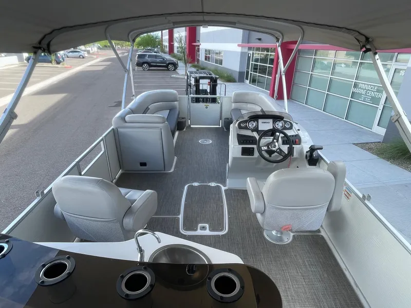 Slide: The Image of 2020 Hurricane FunDeck 236WB OB boat interior with seating and steering console. - 5