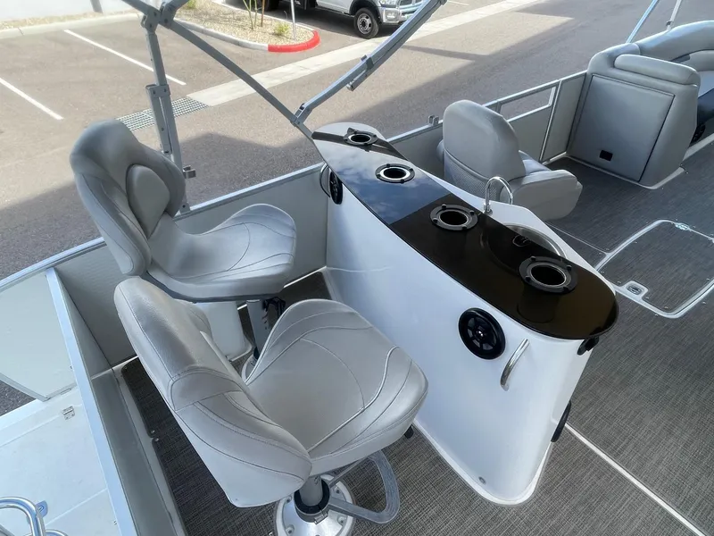 Slide: The Image of 2020 Hurricane FunDeck 236WB OB boat interior with swivel seats and control panel. - 6