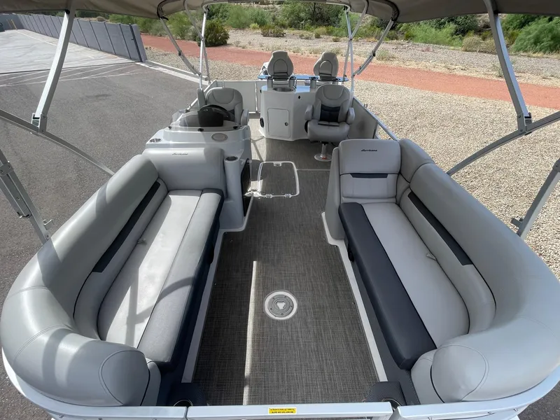 Slide: The Image of 2020 Hurricane FunDeck 236WB OB boat interior with spacious seating and helm. - 8