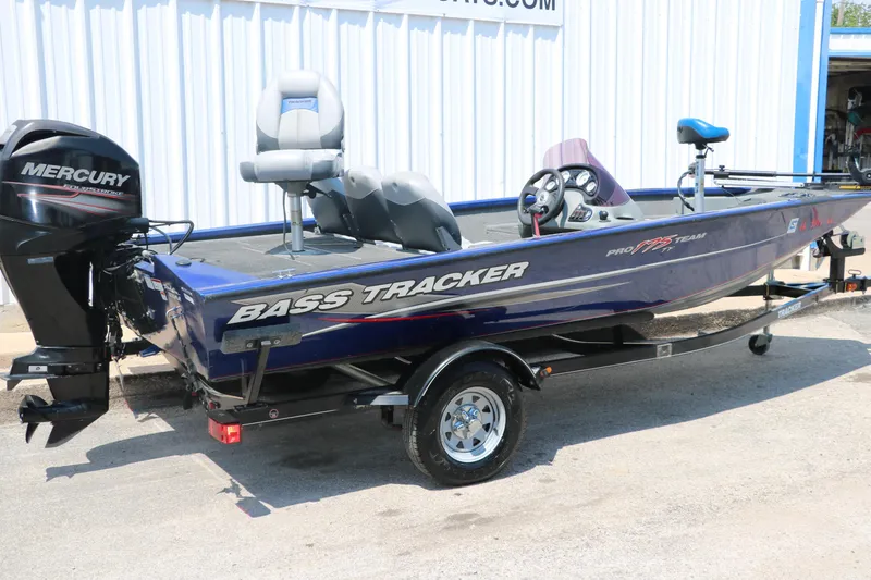 Slide: The Image of 2014 Bass Tracker PT175TF boat with Mercury engine, parked on a trailer. - 12