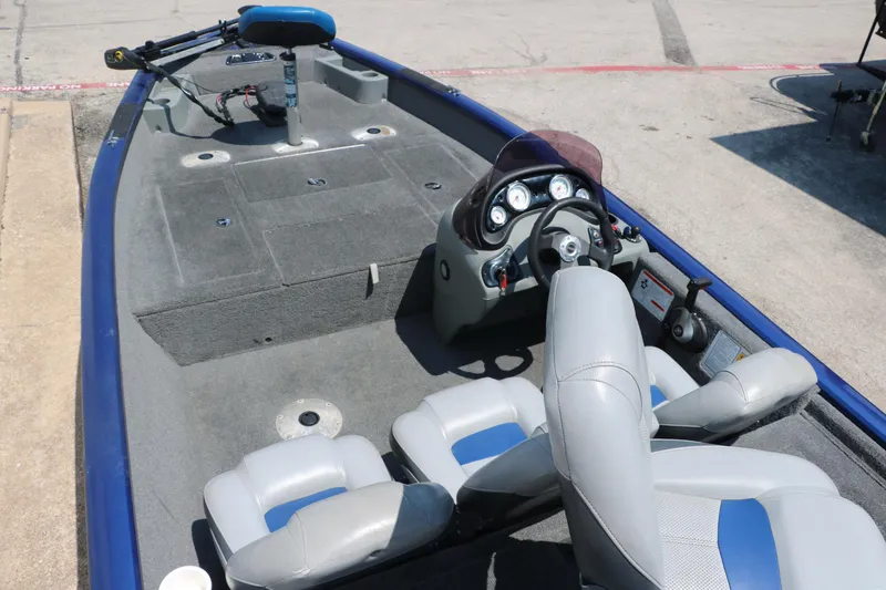 Slide: The Image of 2014 Bass Tracker PT175TF boat interior with steering console and seating. - 15
