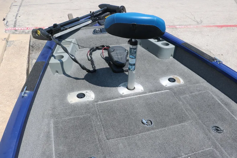 Slide: The Image of 2014 Bass Tracker PT175TF boat deck with blue seat and trolling motor. - 17