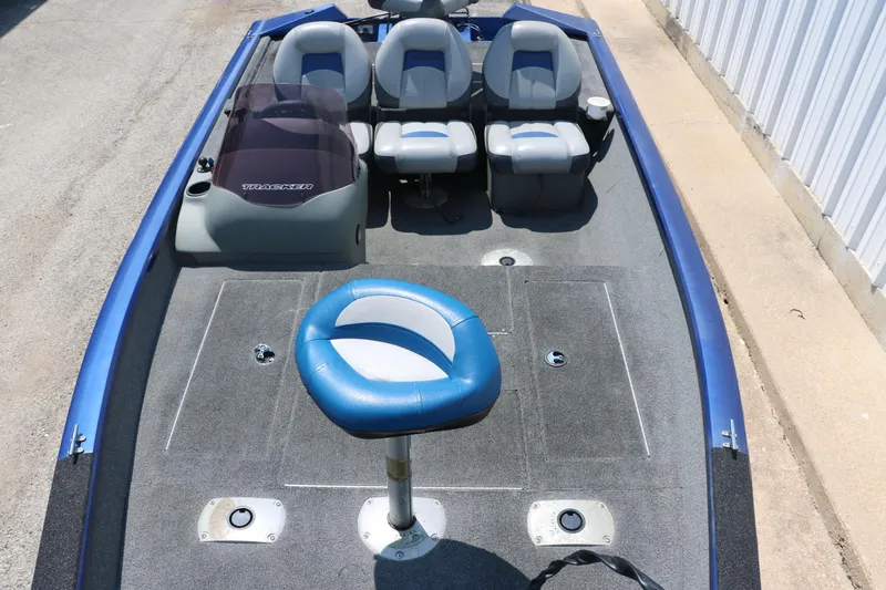 Slide: The Image of 2014 Bass Tracker PT175TF boat interior with seating and steering console. - 19