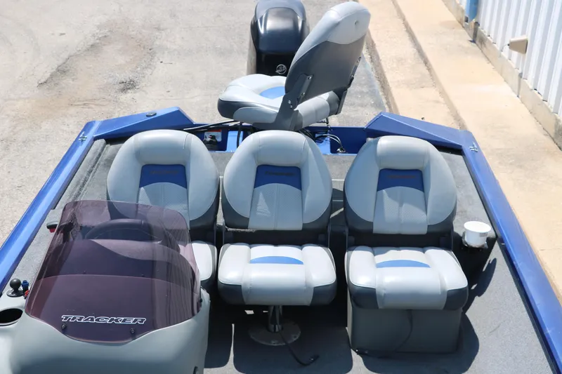 Slide: The Image of 2014 Bass Tracker PT175TF boat interior with four seats and steering console. - 21