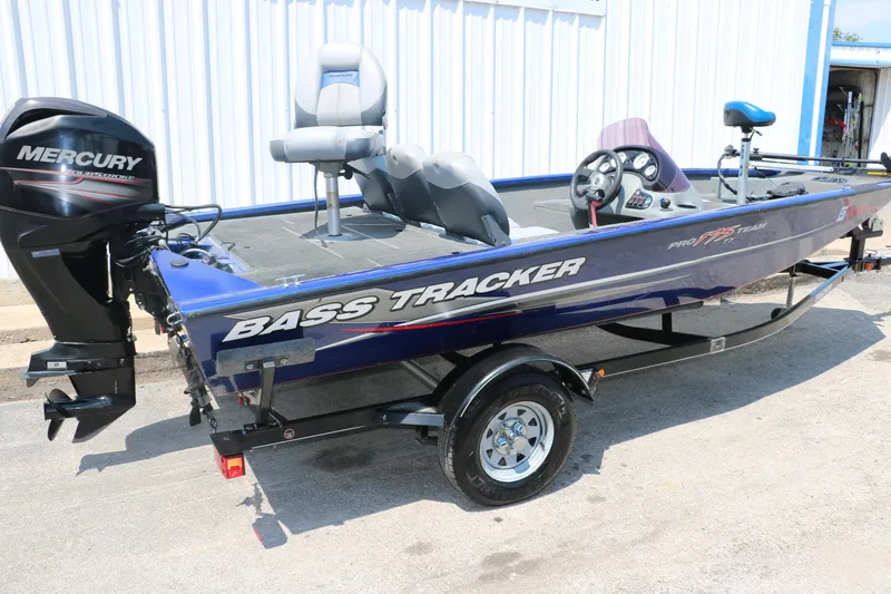 Slide: The Image of 2014 Bass Tracker PT175TF boat with Mercury engine, parked on a trailer. - 3