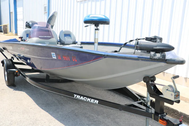 Slide: The Image of 2014 Bass Tracker PT175TF boat on trailer, parked outdoors. - 8