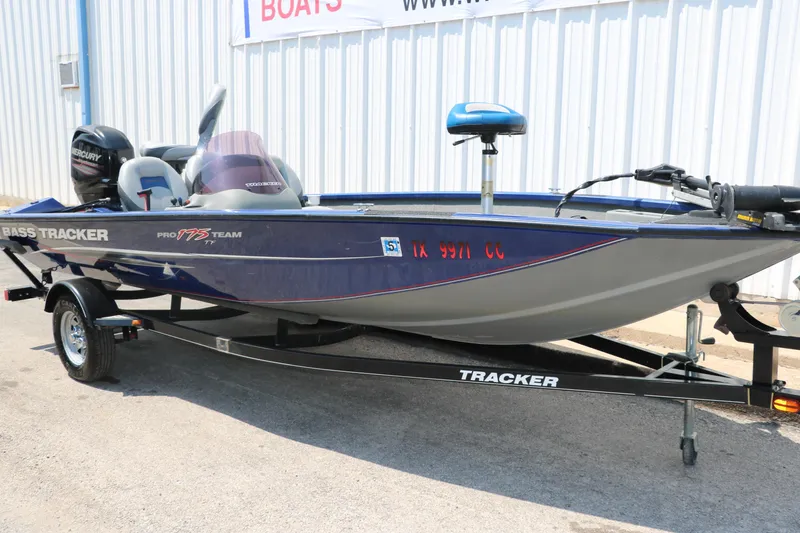 Slide: The Image of 2014 Bass Tracker PT175TF fishing boat on trailer, parked outdoors. - 9