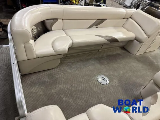 Slide: The Image of 2008 SunChaser 8522 boat interior with beige seating and carpet, featuring "Boat World" logo. - 11