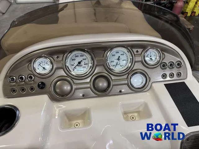 Slide: The Image of 2008 SunChaser 8522 boat dashboard with gauges and controls, featuring Boat World logo. - 21