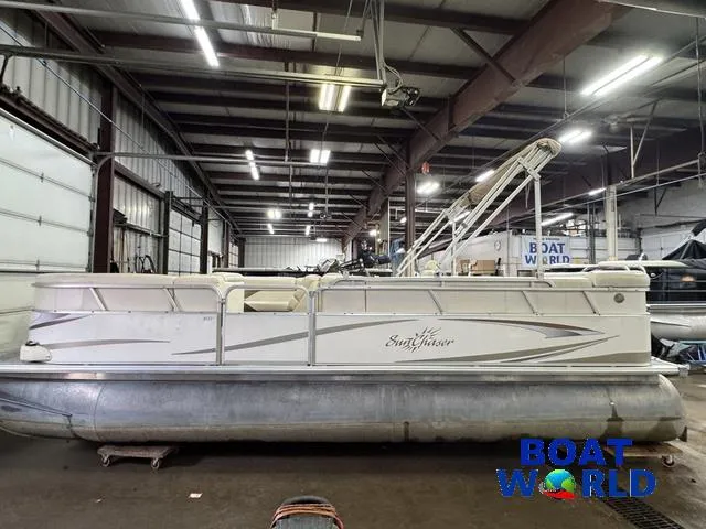 Slide: The Image of 2008 SunChaser 8522 pontoon boat in a warehouse, side view. - 23