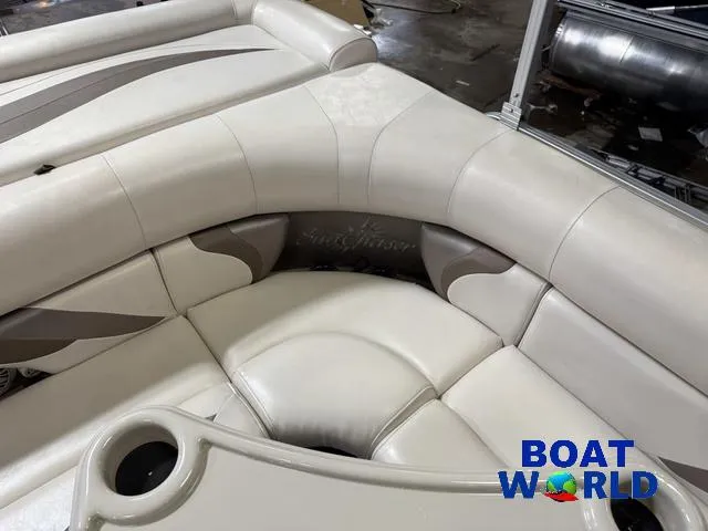 Slide: The Image of 2008 SunChaser 8522 boat interior with beige seating and cup holders at Boat World. - 27