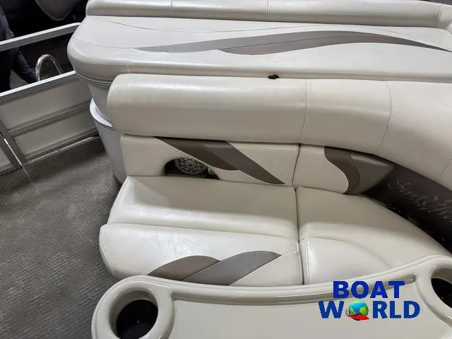 Slide: The Image of 2008 SunChaser 8522 boat interior with beige seating and cup holders, branded "Boat World." - 28