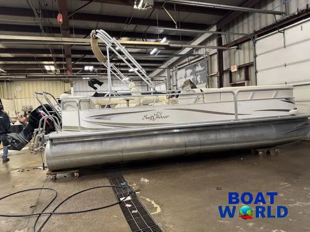 Slide: The Image of 2008 SunChaser 8522 pontoon boat in a warehouse, labeled "Boat World." - 30